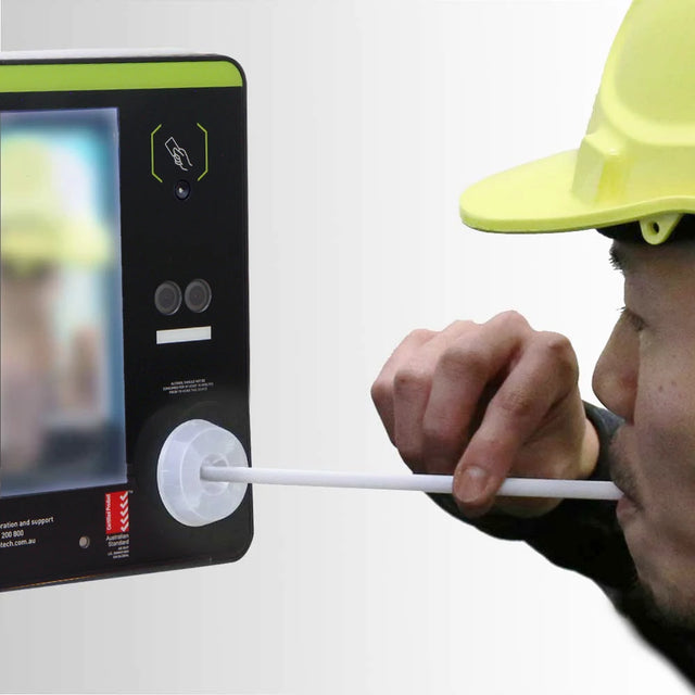 Man blowing into straw and straw adaptor on Andatech Soberlive FRX breathalyser