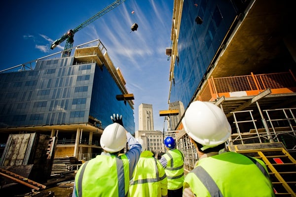 Building under construction with workers