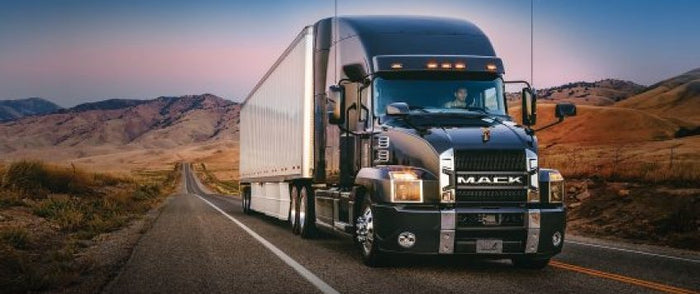 A indutrial truck driving on the road