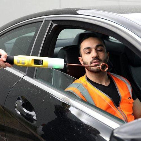 Andatech Sentry X contactless baton breathalyser testing a driver